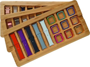 Two wooden trays with various smartwatch bands.