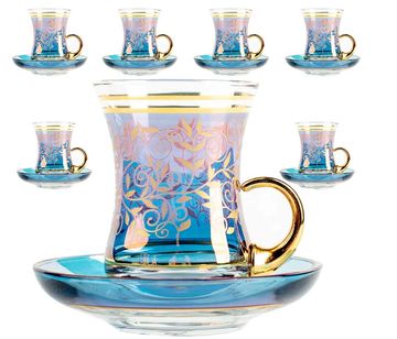 Decorative blue and gold tea glasses with matching saucers.