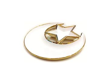 Golden crescent moon with a star inside.