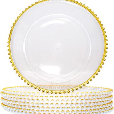 Set of clear plates with gold beaded edges, stacked neatly.