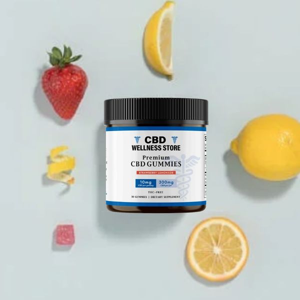 Bottle of CBD Wellness Store premium quality gummies that are surrounded by strawberries and lemons