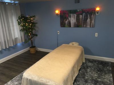 Relaxing spa room where cbd oil massage services are available for Swedish & Deep Tissue massage