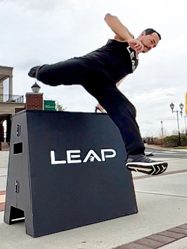 Kids training parkour on Parkour equipment during parkour classes that build confidence & strength.