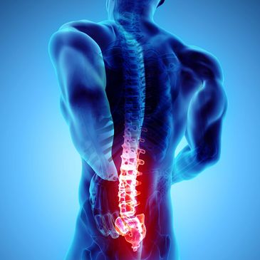 Person holding the lower back while standing, representing chronic low back pain, stiffness, and rec