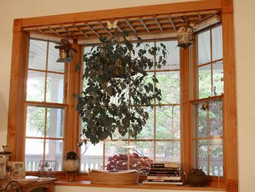 Bay windows  extend outward from the building, creating extra space that can be used for seating or 