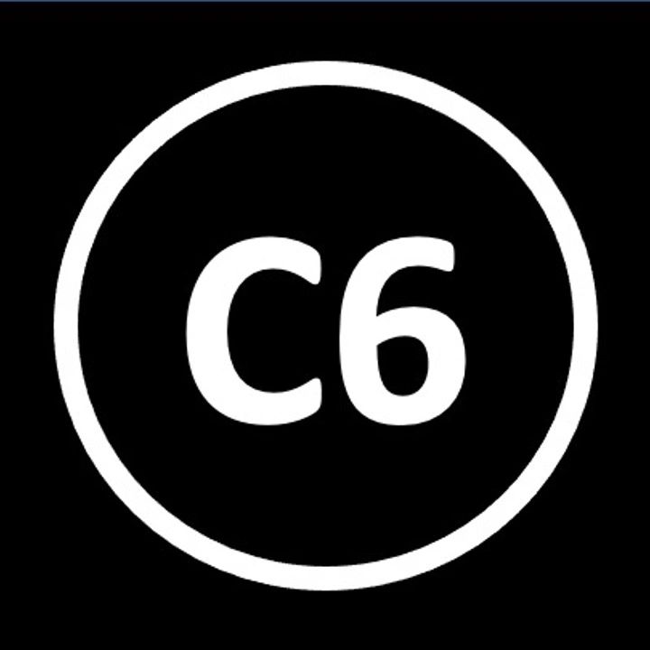 White C6 inside a circle on black background.