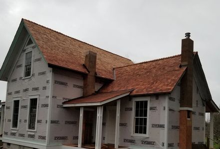 Cedar shingles installed like it was the year 1860 again.
