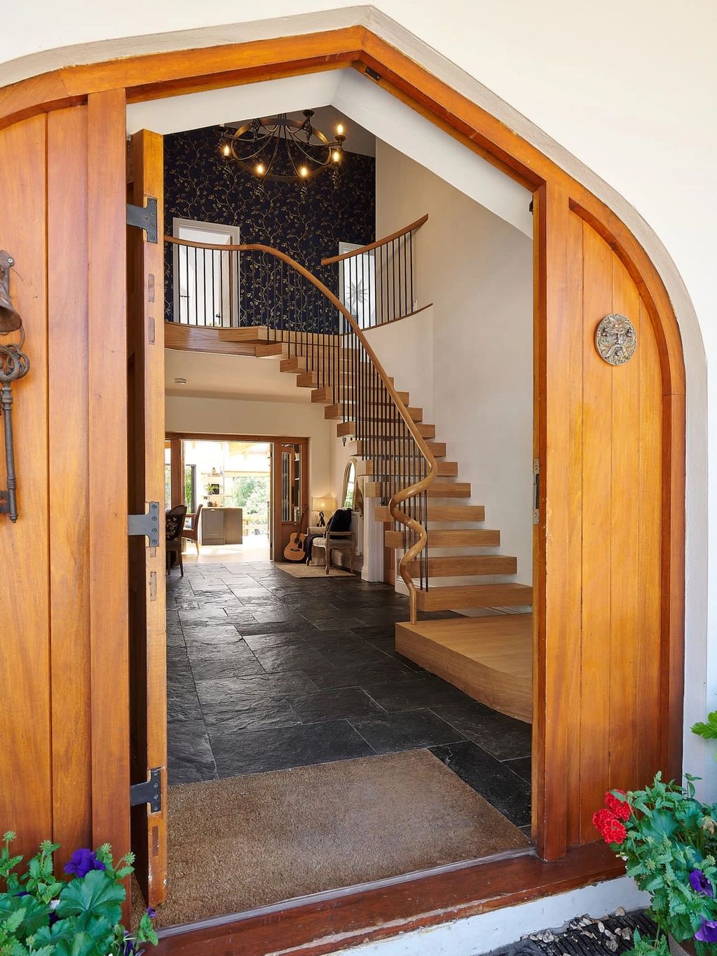Oak Cantilevered Staircase with wrought iron spindles and a matching gallery landing