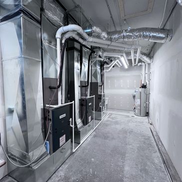 Industrial HVAC system in a utility room.