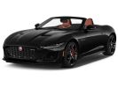 Sleek black convertible sports car with the top down.