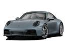 Sleek gray sports car with aerodynamic design and black wheels.