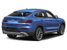 Sleek blue luxury SUV with modern design and sporty rear profile.