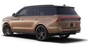 A sleek bronze SUV with black rims and tinted windows.