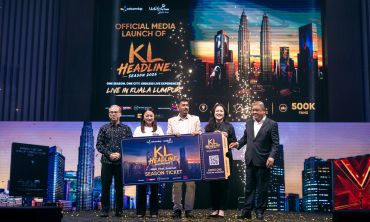 Five people pose with a KL Headline Season 2023 ticket at the official media launch in Kuala Lumpur.
