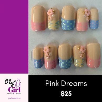 Elegant pastel pink and blue nail set with floral and pearl accents.