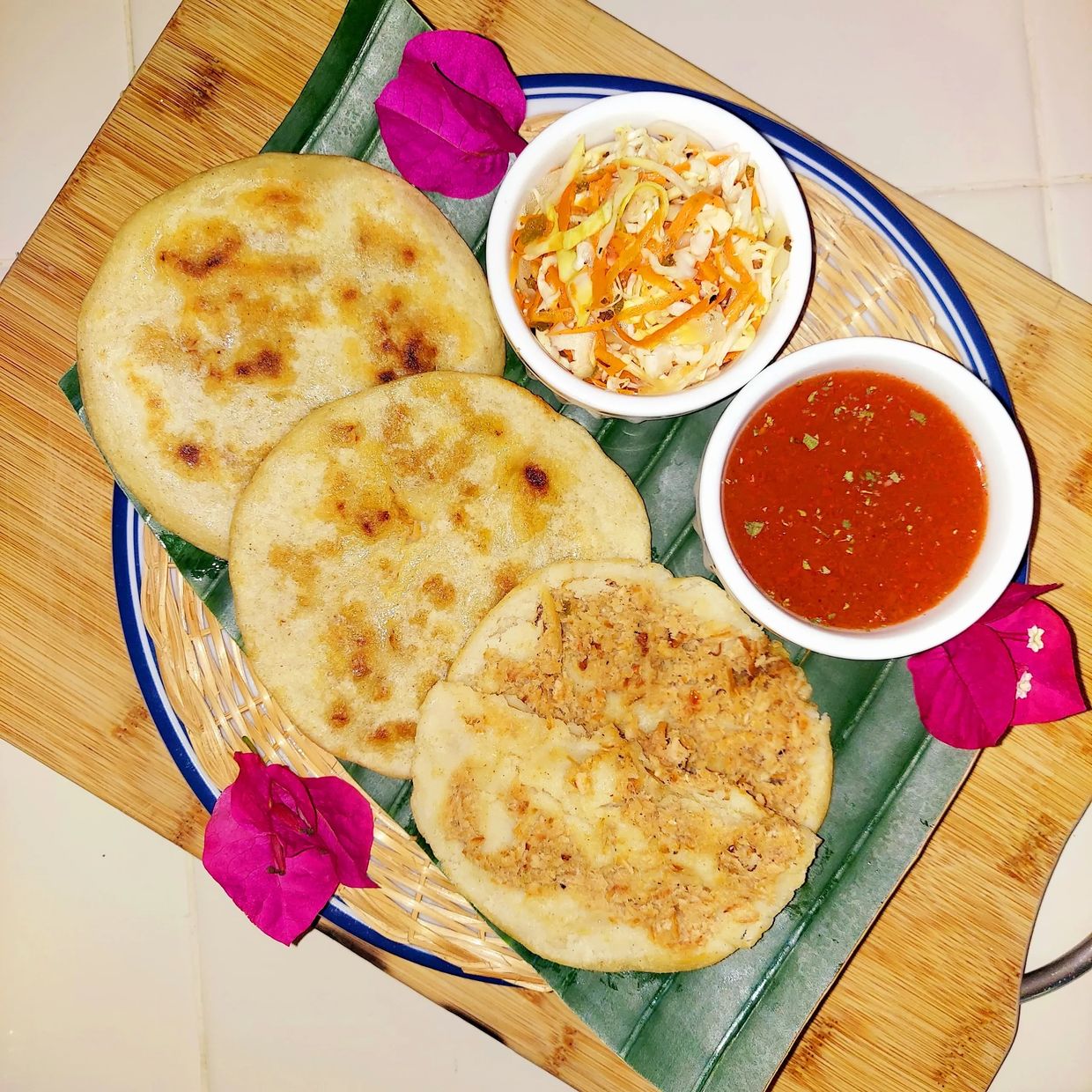 Pupusas, chicharron pupusas with curtido and salsa roja.