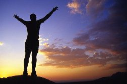 Photo of a man silhouetted against a sunset Photo of a man silhouetted against a sunset
