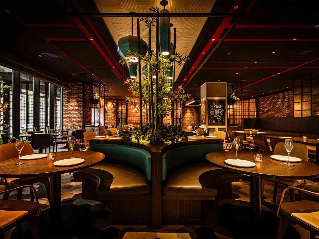 Cozy restaurant interior with warm lighting and stylish seating.
