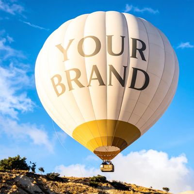 A hot air ballon with the words "YOUR BRAND" displayed on it.