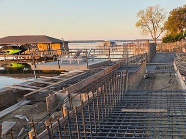 Rebar construction next to lake. 