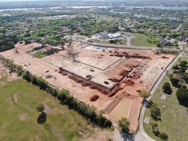 Aerial view of excavated land for Granbury Patio Homes. 