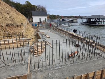 Finished shot of concrete patio next to lake. 