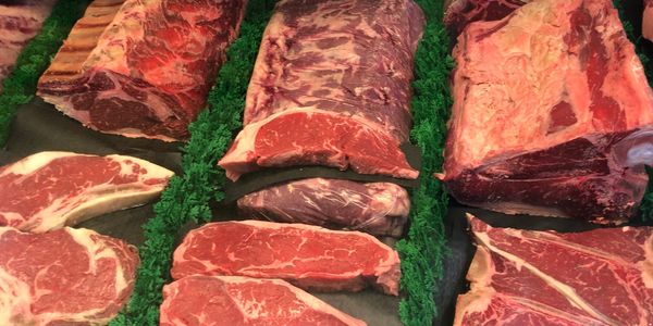 raw meat at meat counter for sale at meat market in Enid, Oklahoma