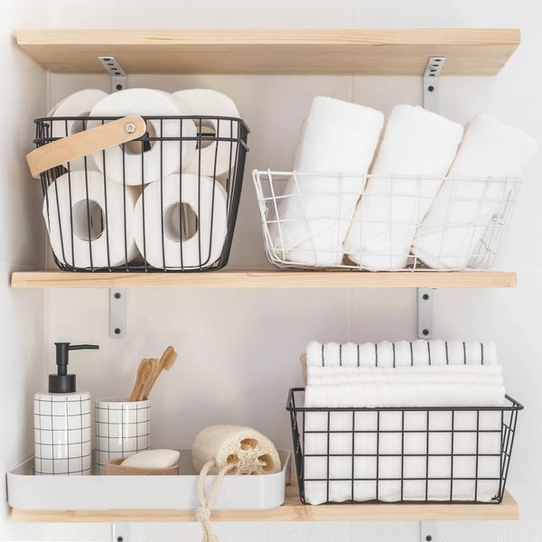 Organized and decluttered bathroom and linen closet supplies
