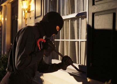 Photo Of Man Breaking Into Home of A Person Not Using House-Sitting Services