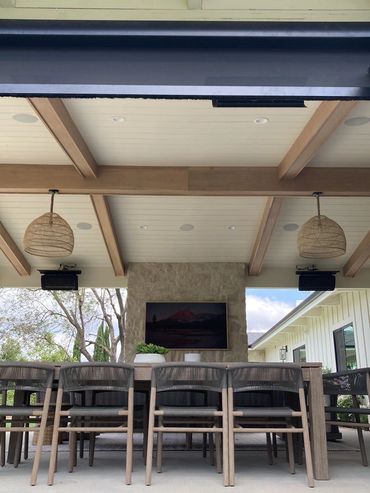 outdoor space covered patio ceiling speakers mounted tv on fireplace entertainment outside custom