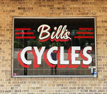 Glass lettering. Script style is a nod to a traveling East Texas Sign Painter.