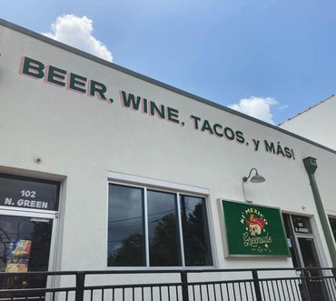 Wall sign. Painted on stucco.