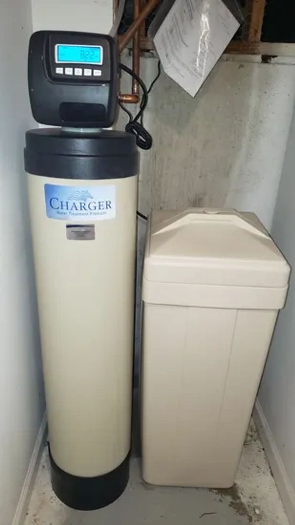 Water softener unit with tank.