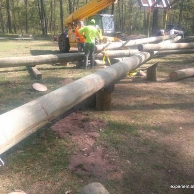 Builders working at a ropes course construction site in Michigan.