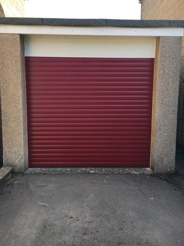 Oxblood red roller garage door