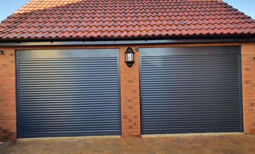 Double install matching anthracite grey rollerdoors installed in Whitminster Gloucester