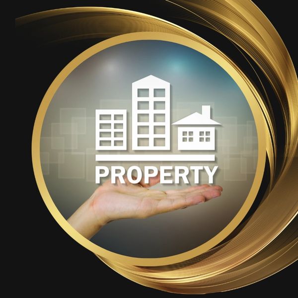 Hand holding digital icons of buildings with the word PROPERTY.