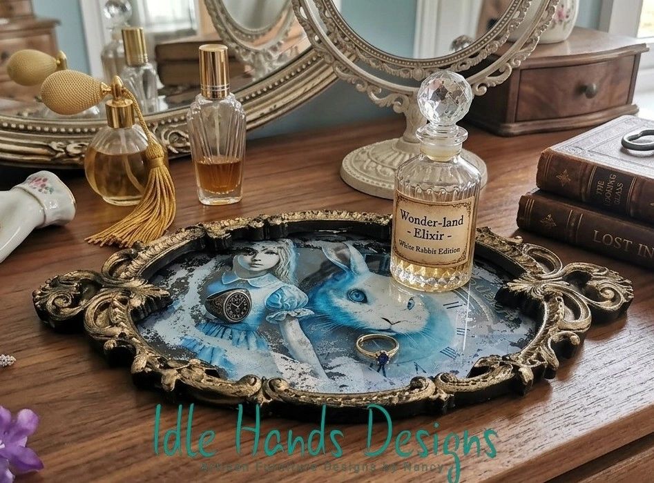Vintage vanity setup with Alice in Wonderland-themed tray and elixir bottle.