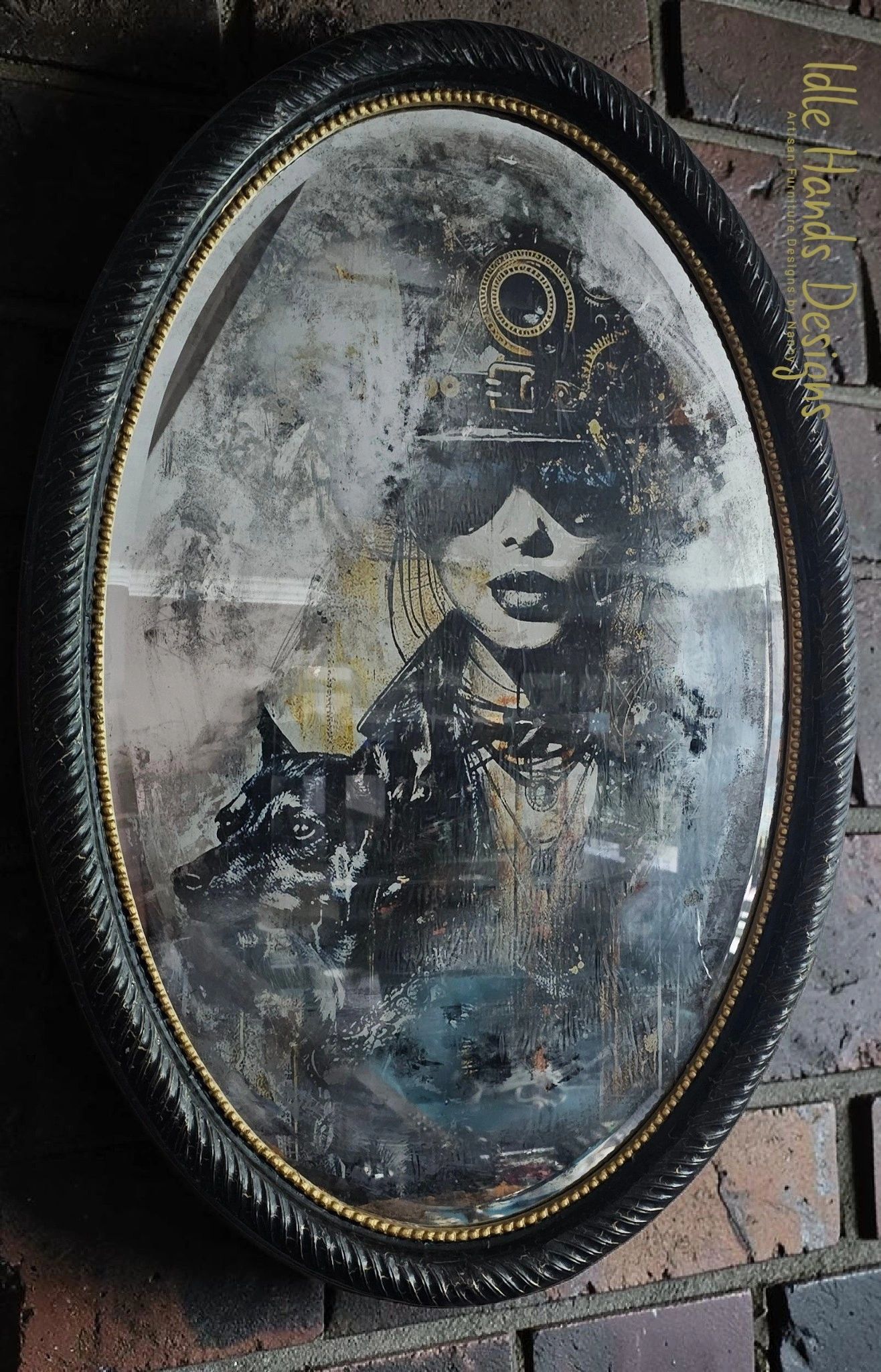 Vintage oval mirror with an artistic portrait of a woman and a dog.