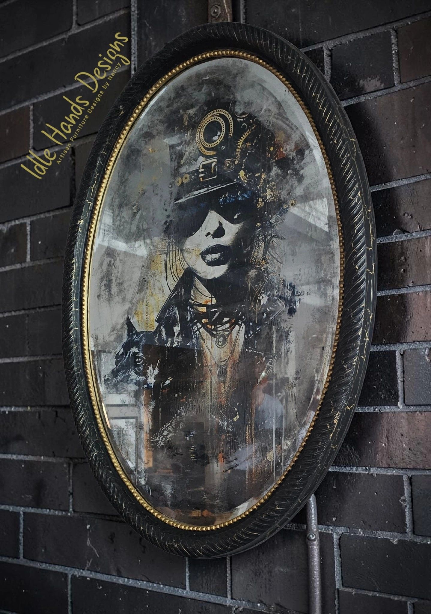 Vintage oval mirror with artistic portrait and dog illustration on a brick wall.