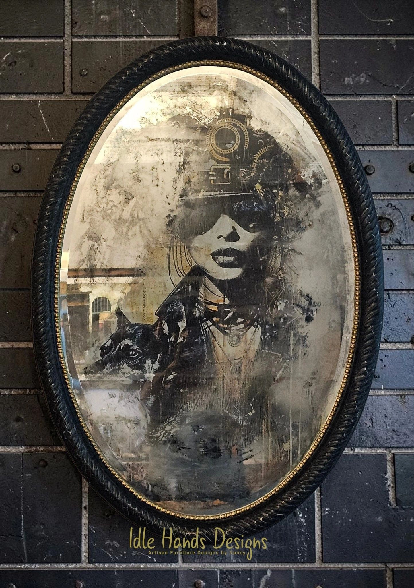 A vintage oval mirror with a faded artistic portrait of a woman and a dog.