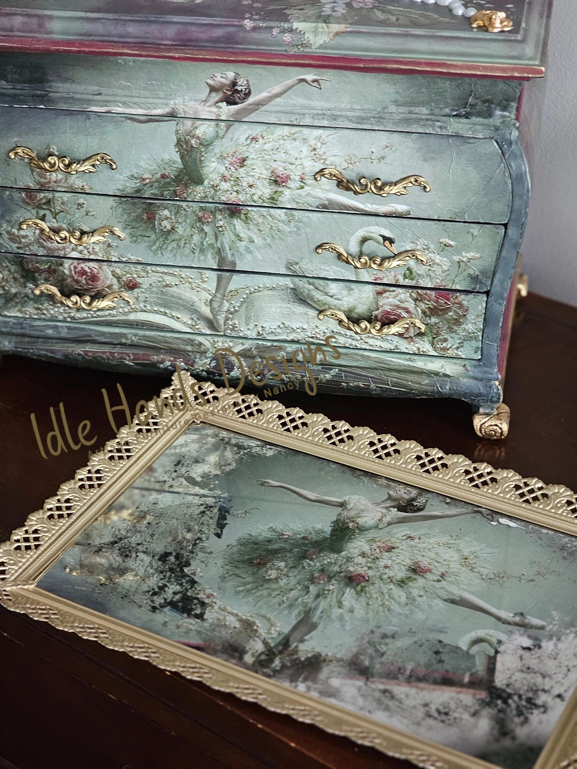 Vintage dresser and mirror featuring a ballerina and swan artwork.