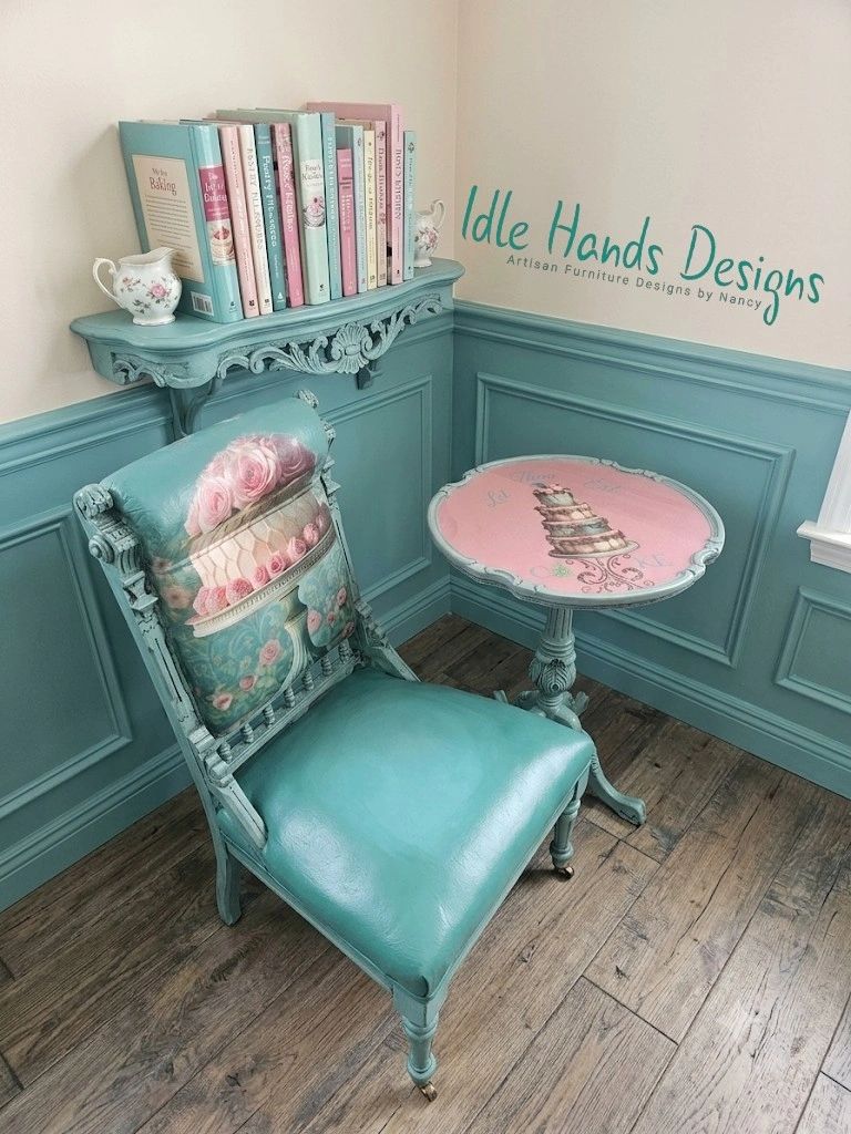 Vintage styled teal chair and matching table with floral cushions.