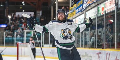 bchl surrey eagles hockey player celebrates after scoring a goal at south surrey arena