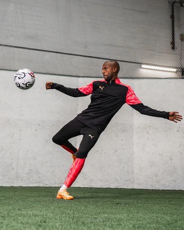 sports photography of fafa picault during a puma photoshoot in vancouver