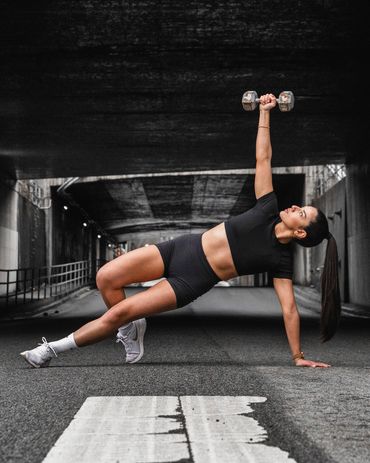 fitness photography of gym girl performing functional exercises outside