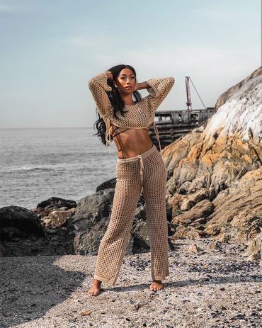 lifestyle photography of woman wearing crochet Beach Cover Up Pants High Waisted Vacation outfit
