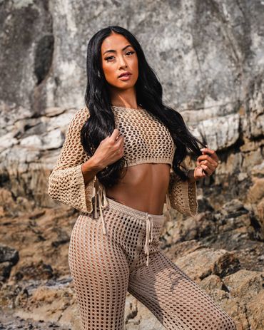 lifestyle photography of woman wearing crochet Beach Cover Up Pants High Waisted Vacation outfit