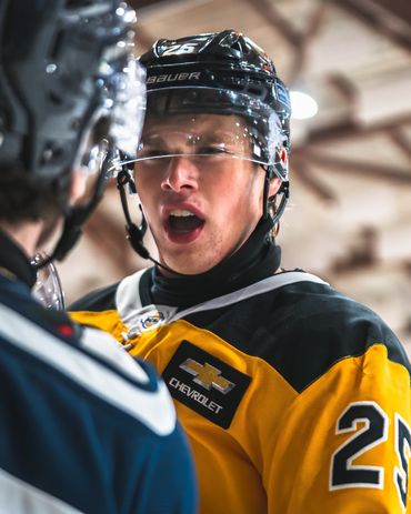 sports photography of bchl hockey players arguing on the ice