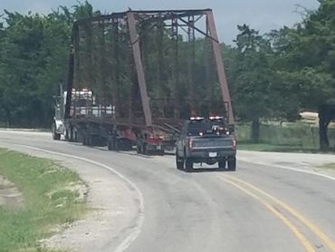 Truck hauling bridge, with pilot truck